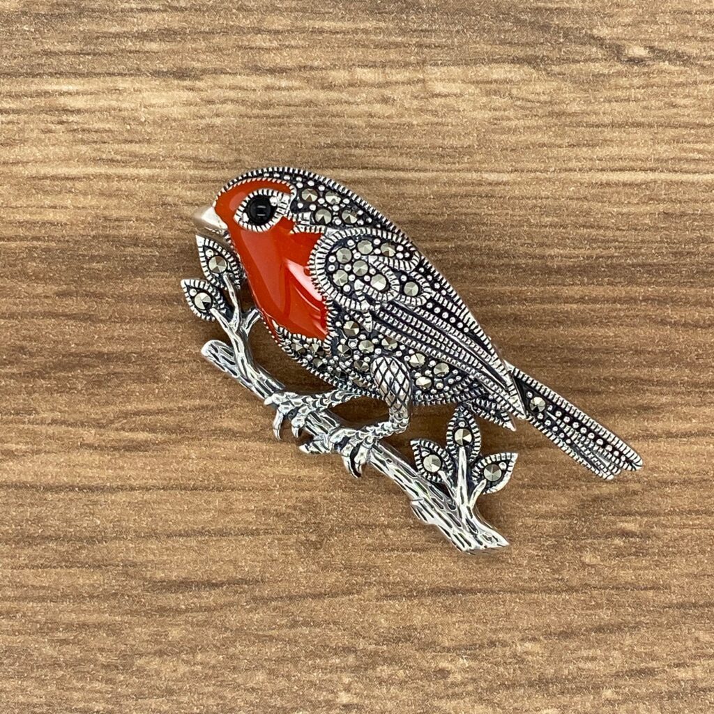 A bird sitting on top of a tree branch.