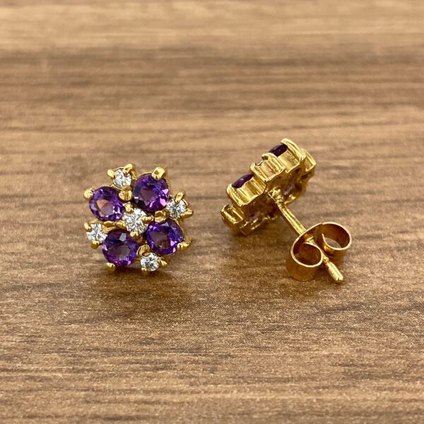 Gold earrings with amethyst and diamonds.