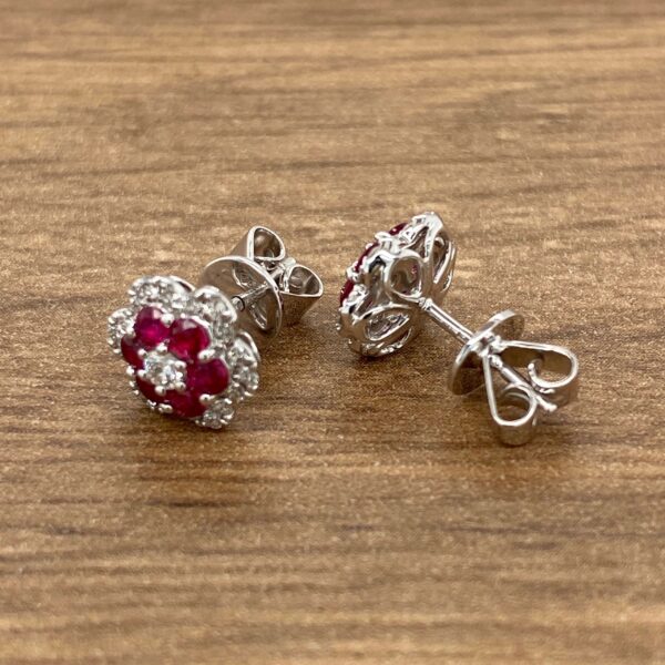 Ruby and diamond flower stud earrings.