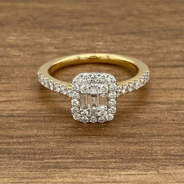 Gold ring with emerald cut diamond.