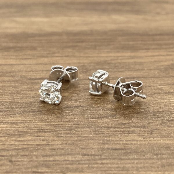 Pair of round diamond stud earrings.