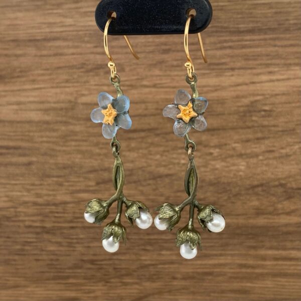 Gold forget-me-not earrings with pearls.