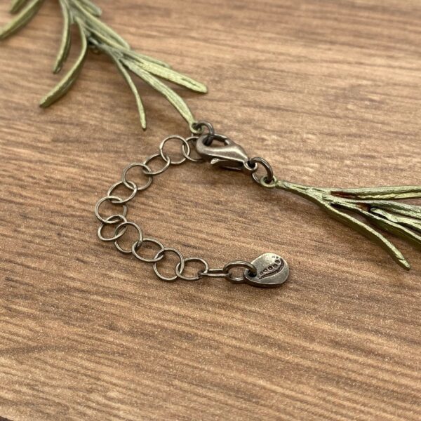 Closeup of a silver chain necklace.