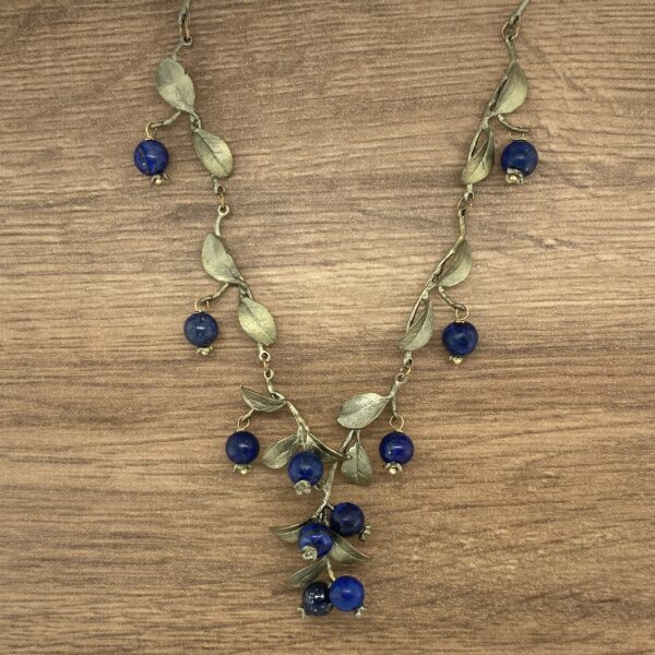 Blue gemstone necklace with leaf accents.