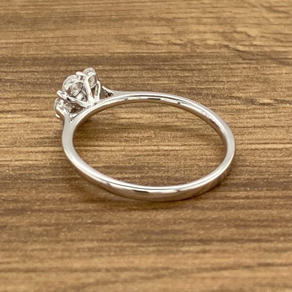 Silver ring with a cluster of diamonds.