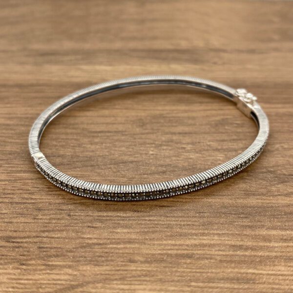 Silver bangle with marcasite stones.