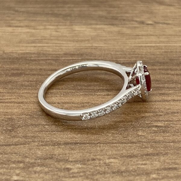Diamond and ruby halo engagement ring.