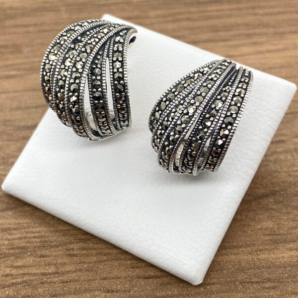 Silver and marcasite hoop earrings.