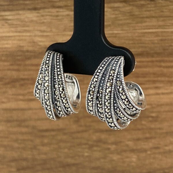 Silver and marcasite hoop earrings.