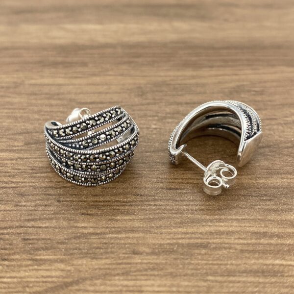 Silver hoop earrings with marcasite stones.
