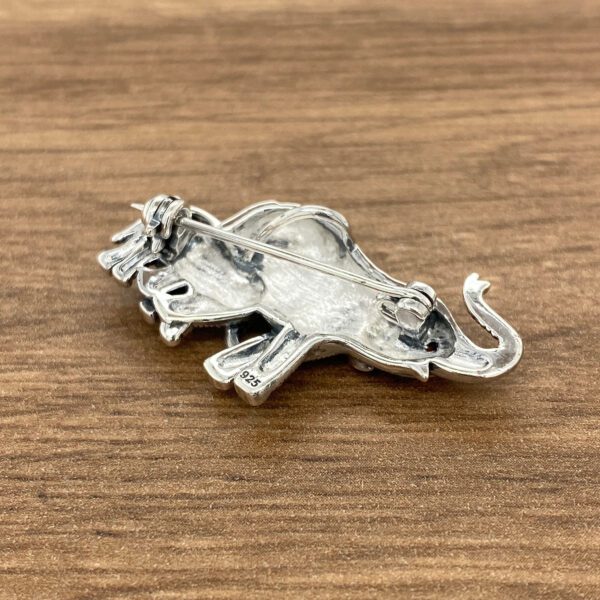 Silver elephant brooch with a pin.