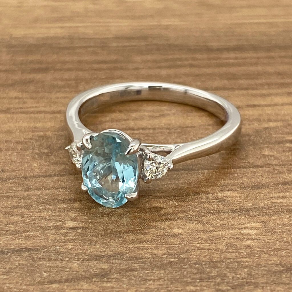 Aquamarine engagement ring with diamond accents.