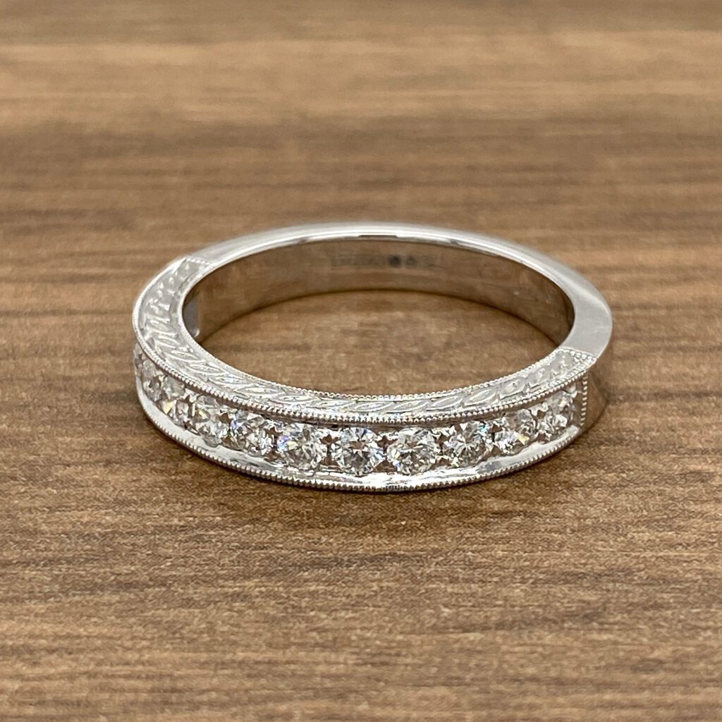 Diamond band with engraved design.