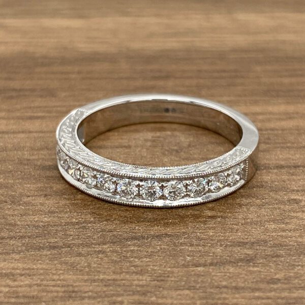 Diamond band with engraved design.