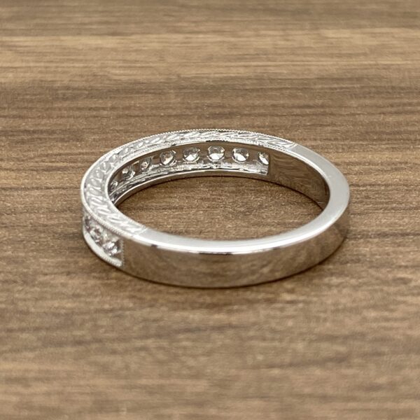Silver band with round diamonds.