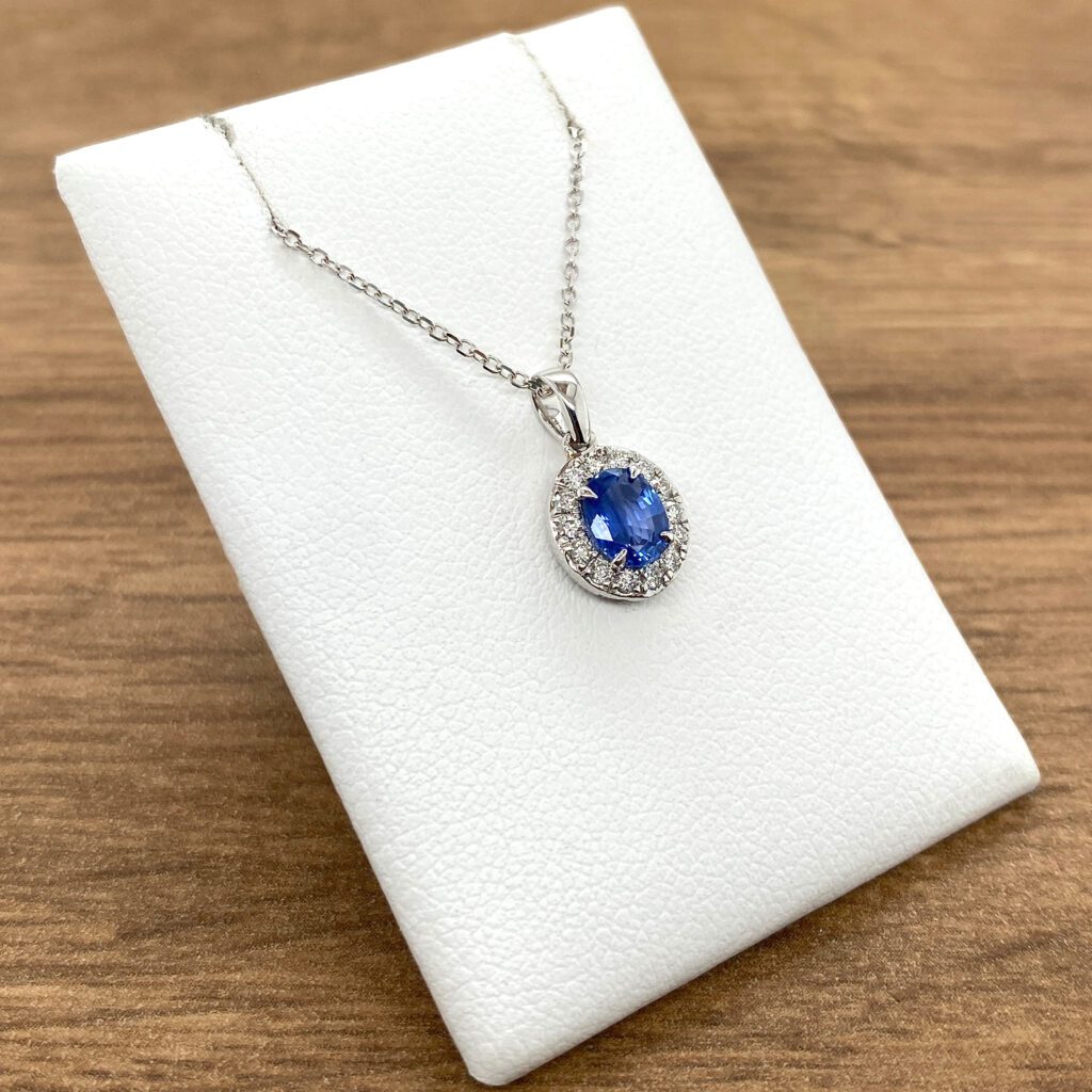 Silver necklace with blue sapphire and diamonds.