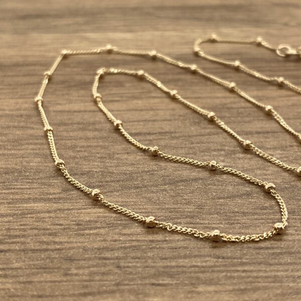 Gold chain necklace with beads