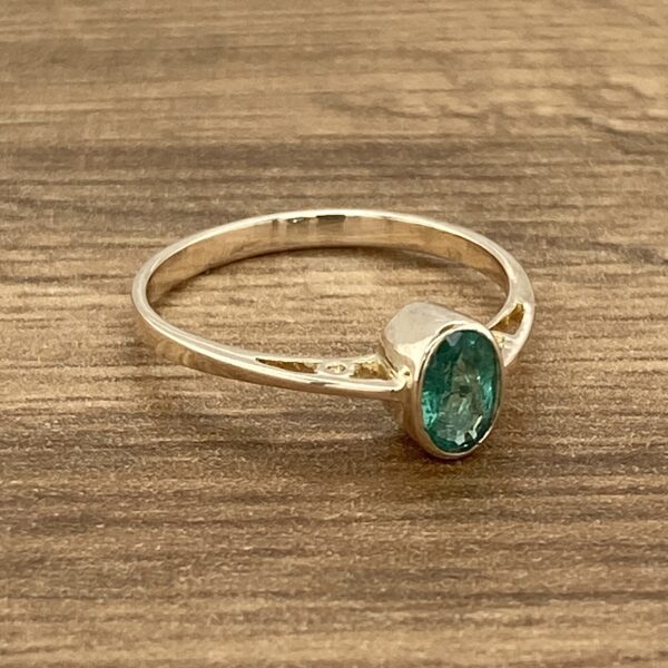 Silver ring with a green gemstone.