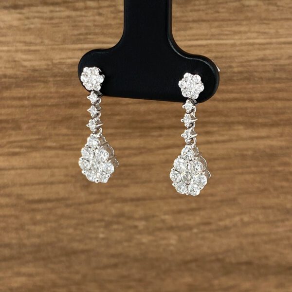 Diamond drop earrings on display.