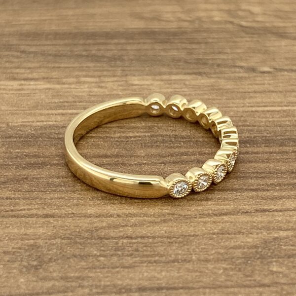 Gold band with round diamonds.