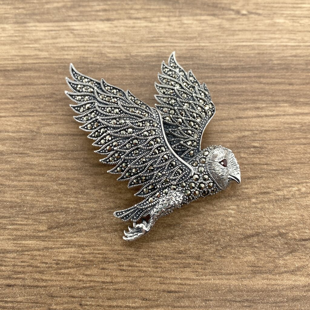 Silver owl brooch with marcasite stones.