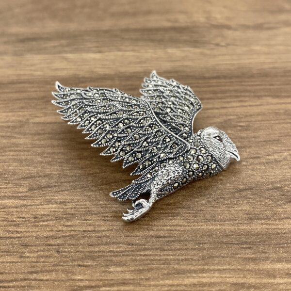 Silver owl brooch with marcasite stones.