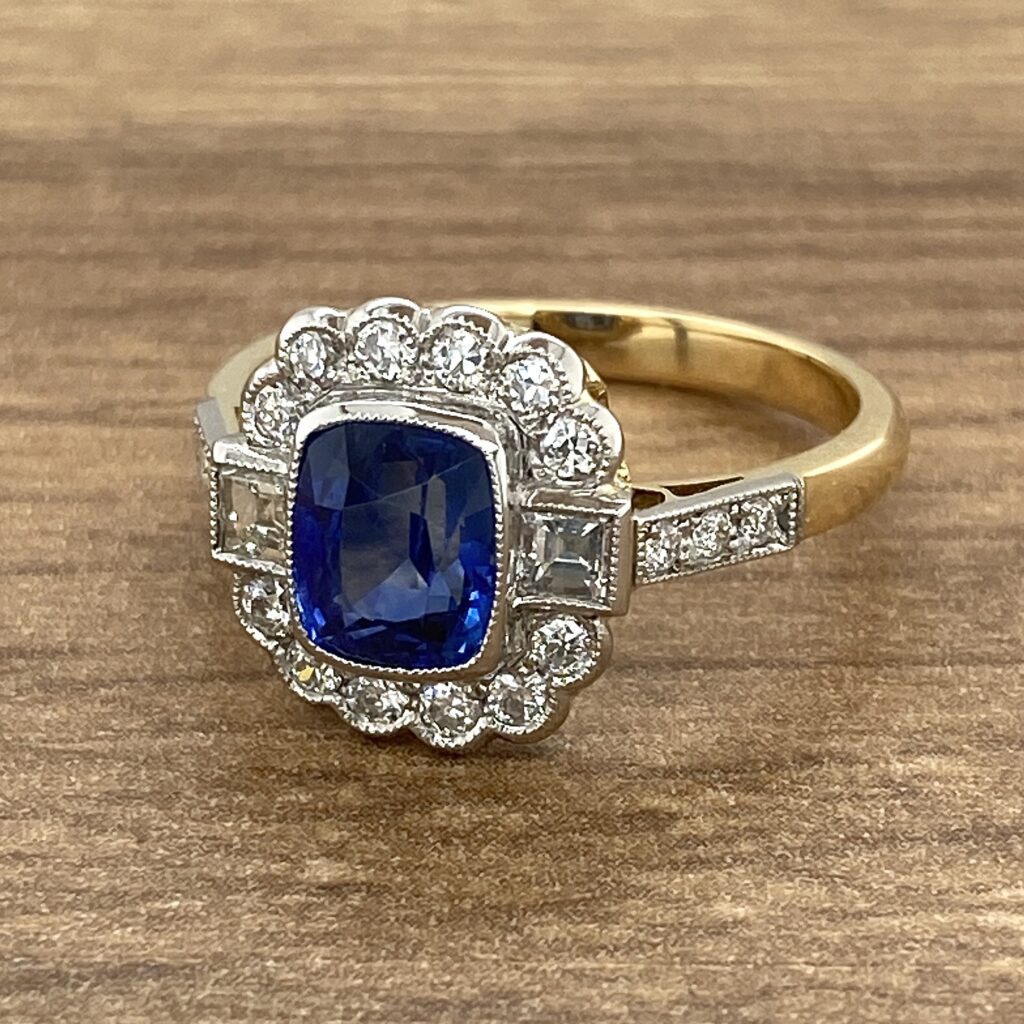 Gold ring with sapphire and diamonds.
