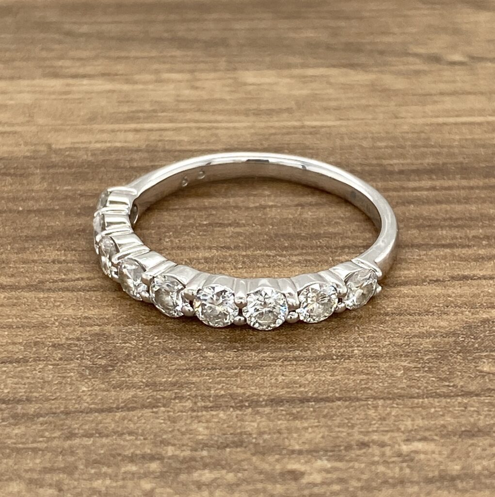 Silver band with round diamonds.