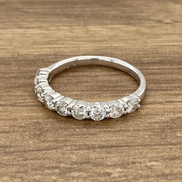 Silver band with round diamonds.