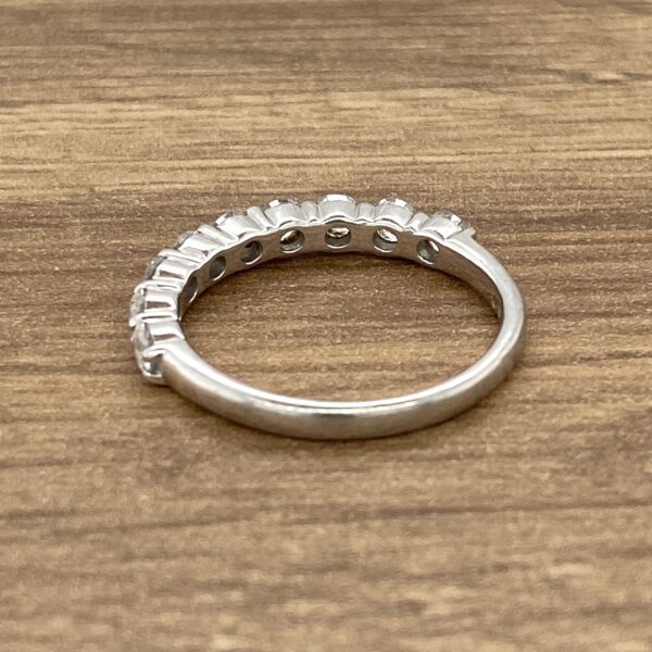 Silver band with small diamonds.