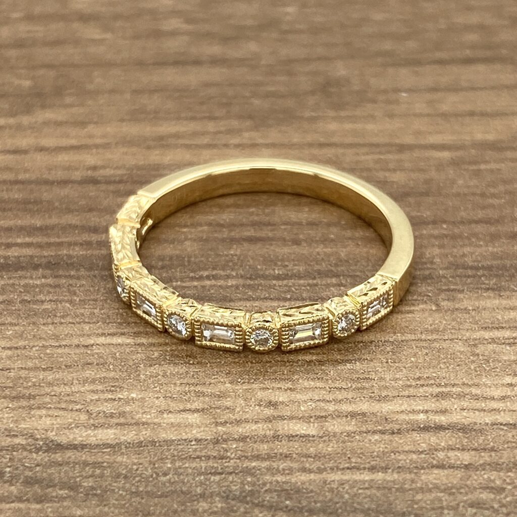 Gold band with baguette and round diamonds.