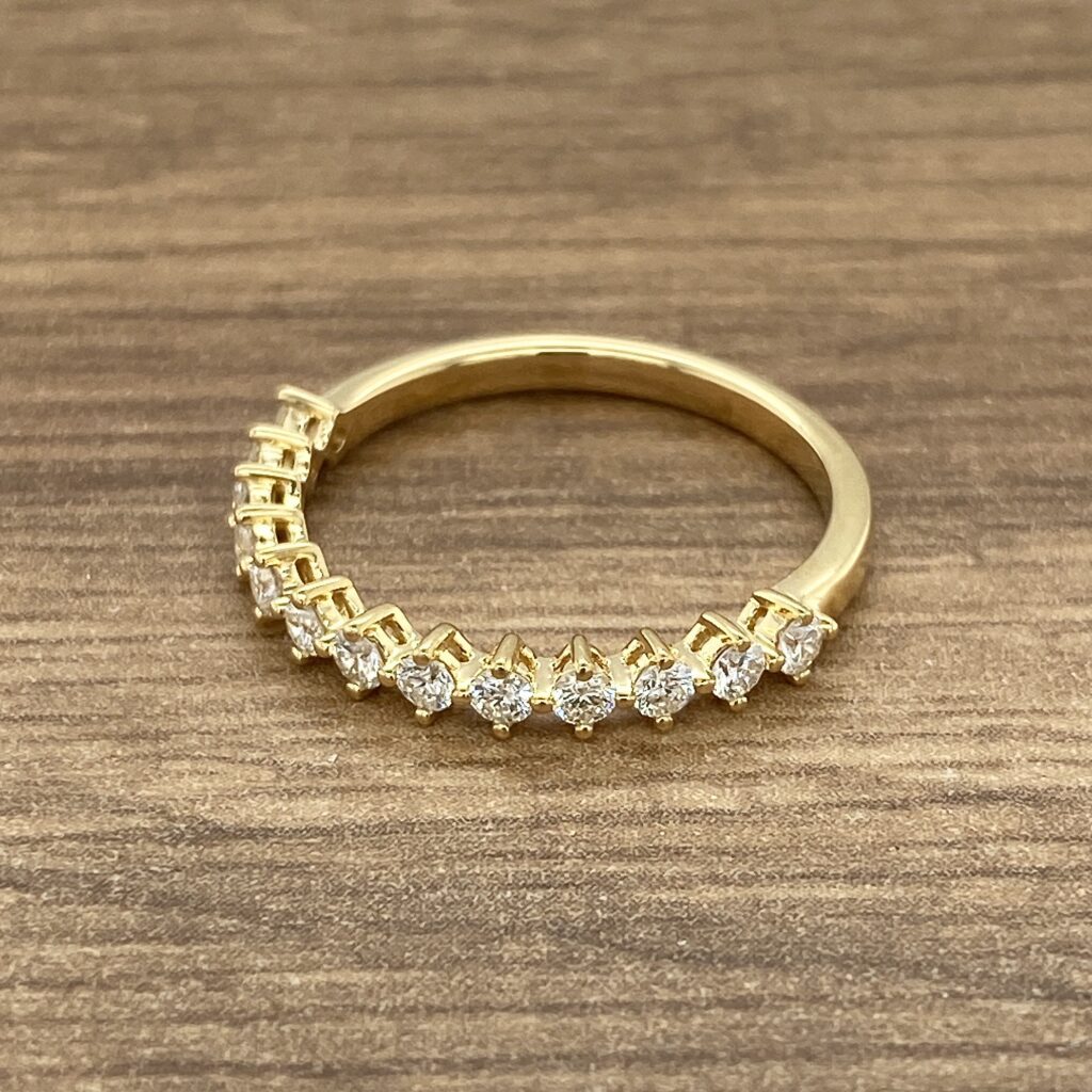 Gold band with diamond stones.