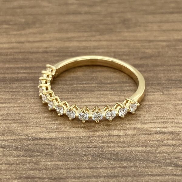 Gold band with diamond stones.