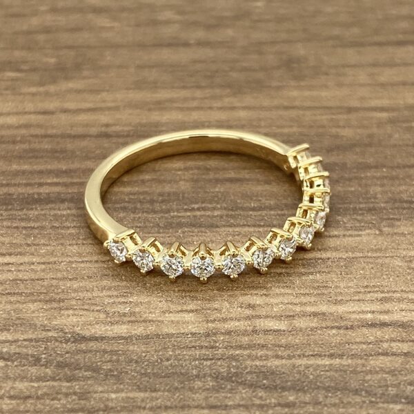Gold band with round diamonds.