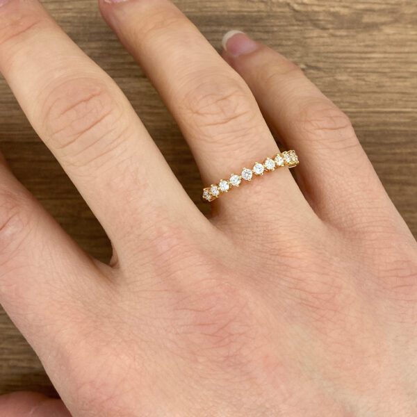 Gold band with round diamonds.