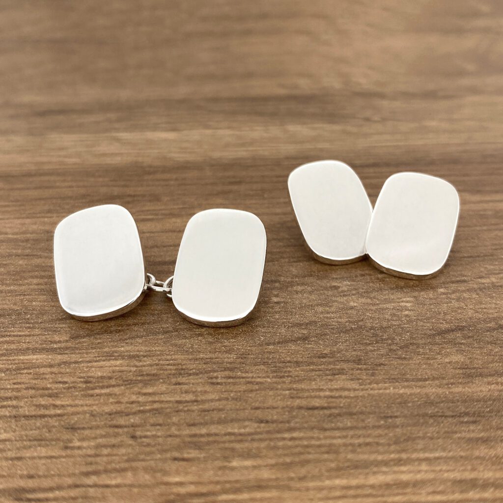 Pair of silver oval cufflinks.