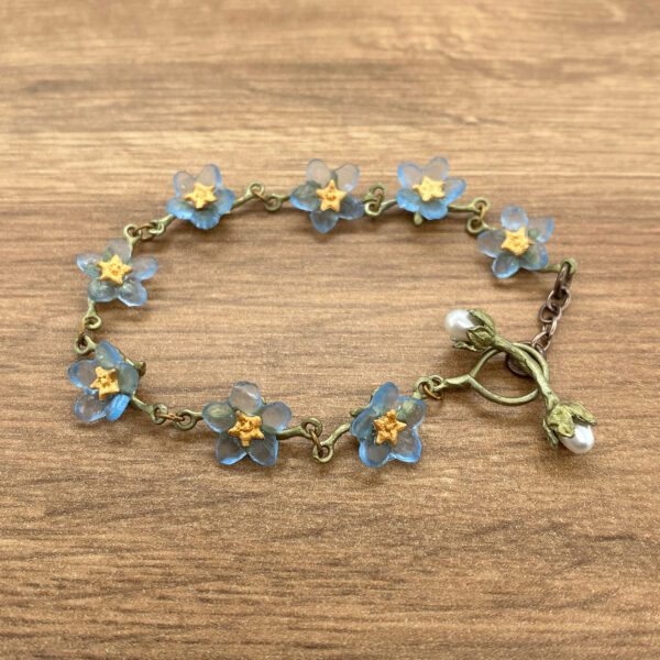 Forget-me-not flower bracelet with pearl charm.