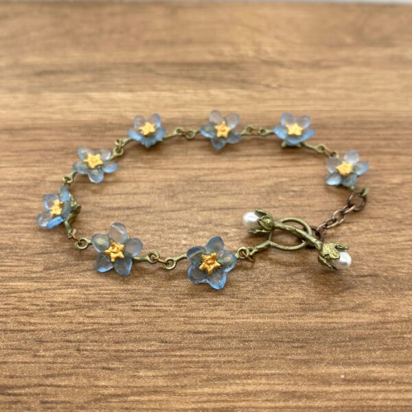 Blue forget-me-not flower charm bracelet.