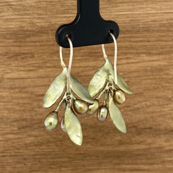 Gold leaf and pearl dangle earrings.