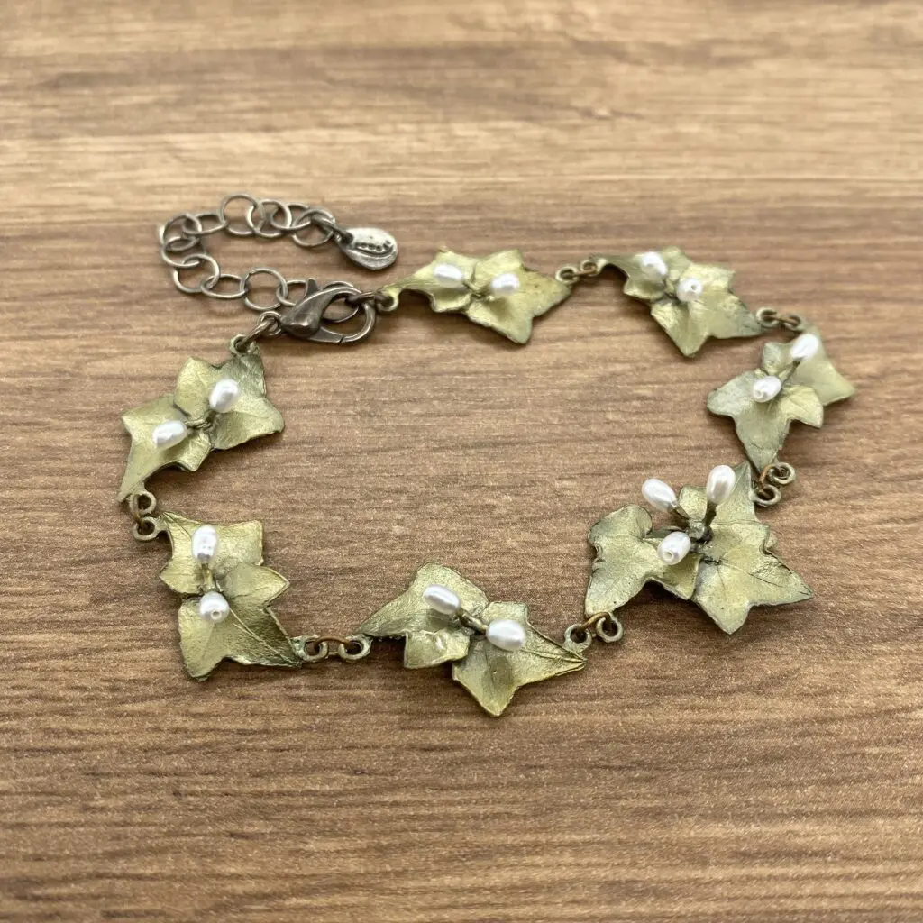Gold ivy leaf bracelet with pearls.