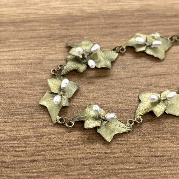 Gold ivy leaf necklace with pearls.