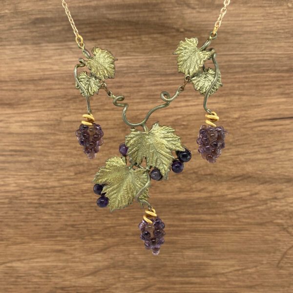 Gold grapevine necklace with amethyst grapes.