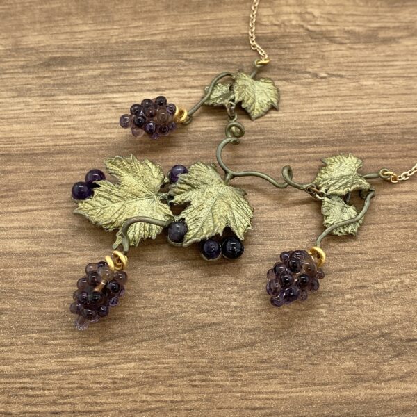 Gold grapevine necklace with amethyst grapes.