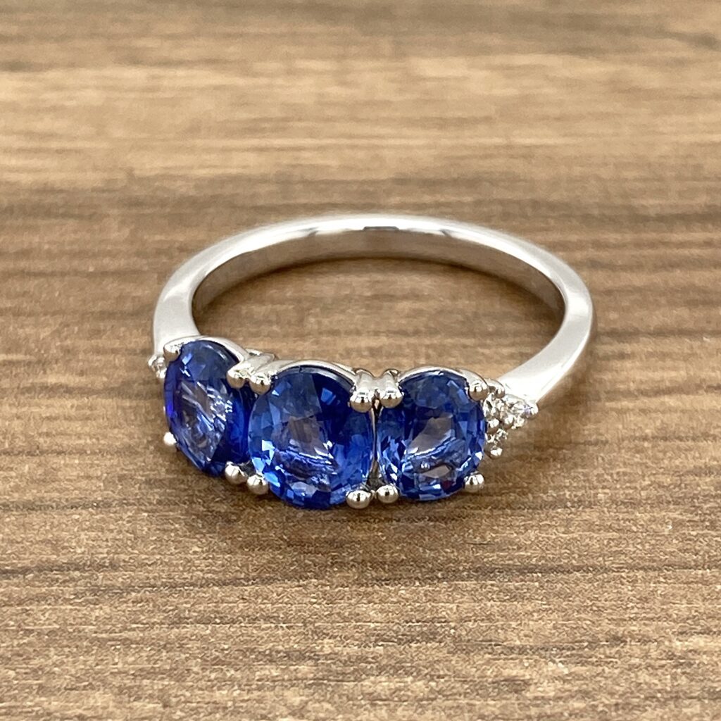 White gold ring with three sapphires.