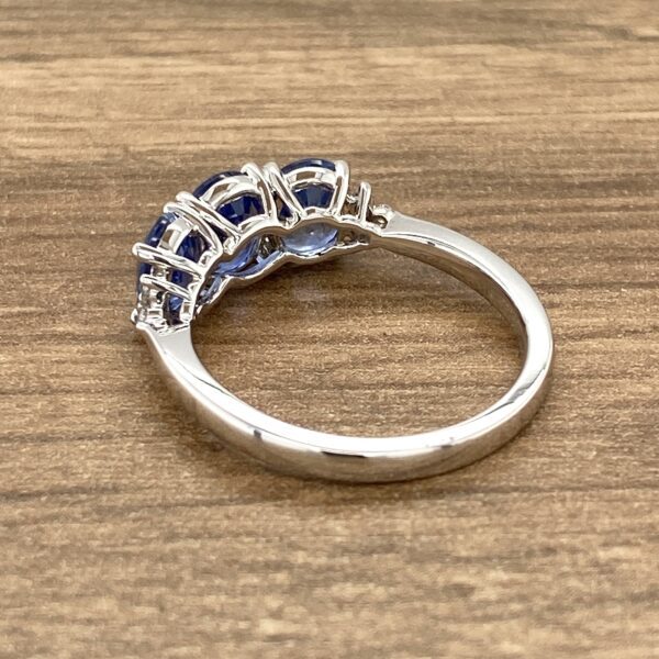 Silver ring with three blue sapphires.