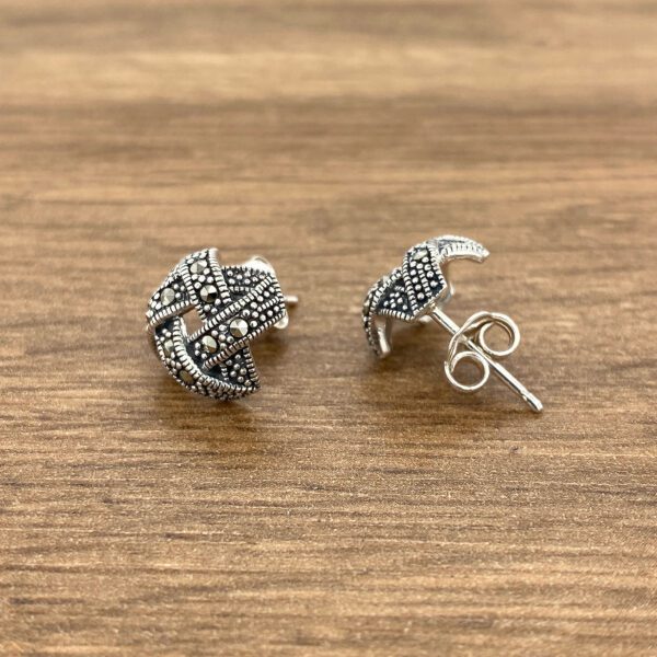Silver and marcasite knot earrings.