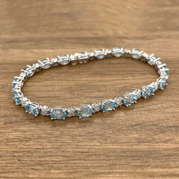 Aquamarine and diamond tennis bracelet.