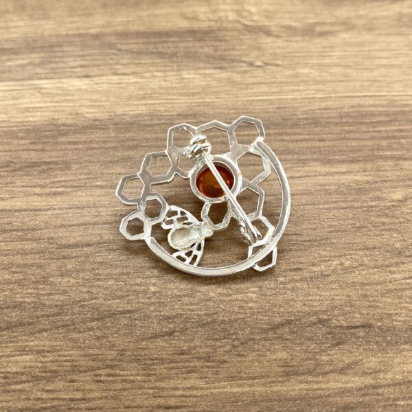 Silver bee honeycomb brooch back view.