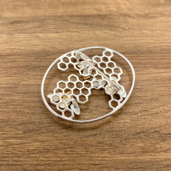 Silver bee honeycomb brooch back view.