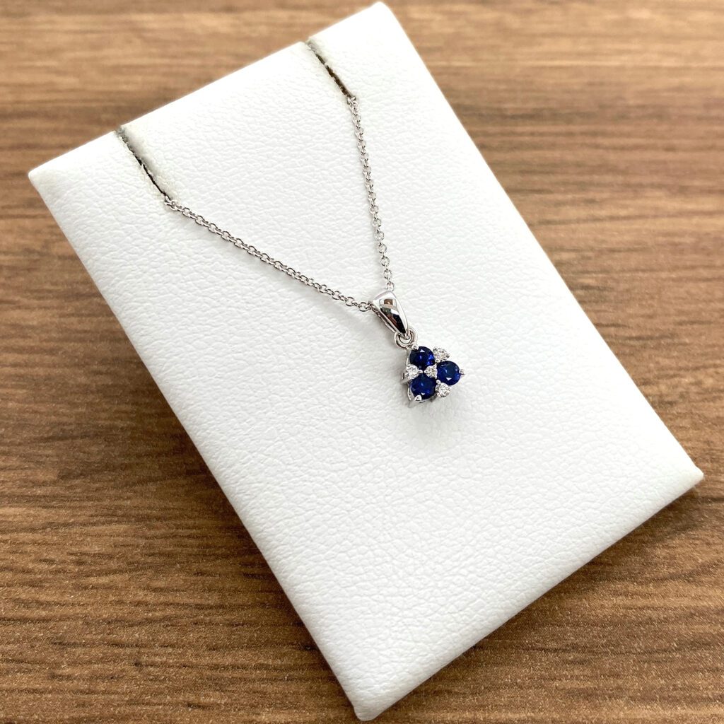 Elegant sapphire and diamond pendant necklace.